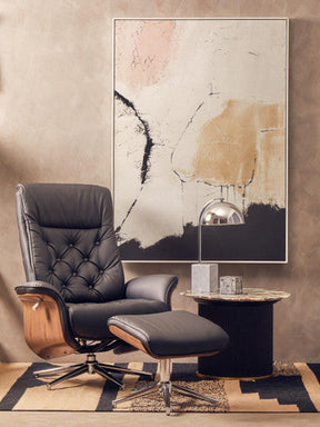 Stylish living room featuring the Trenza Rug, a modern design with a black chair and contemporary artwork