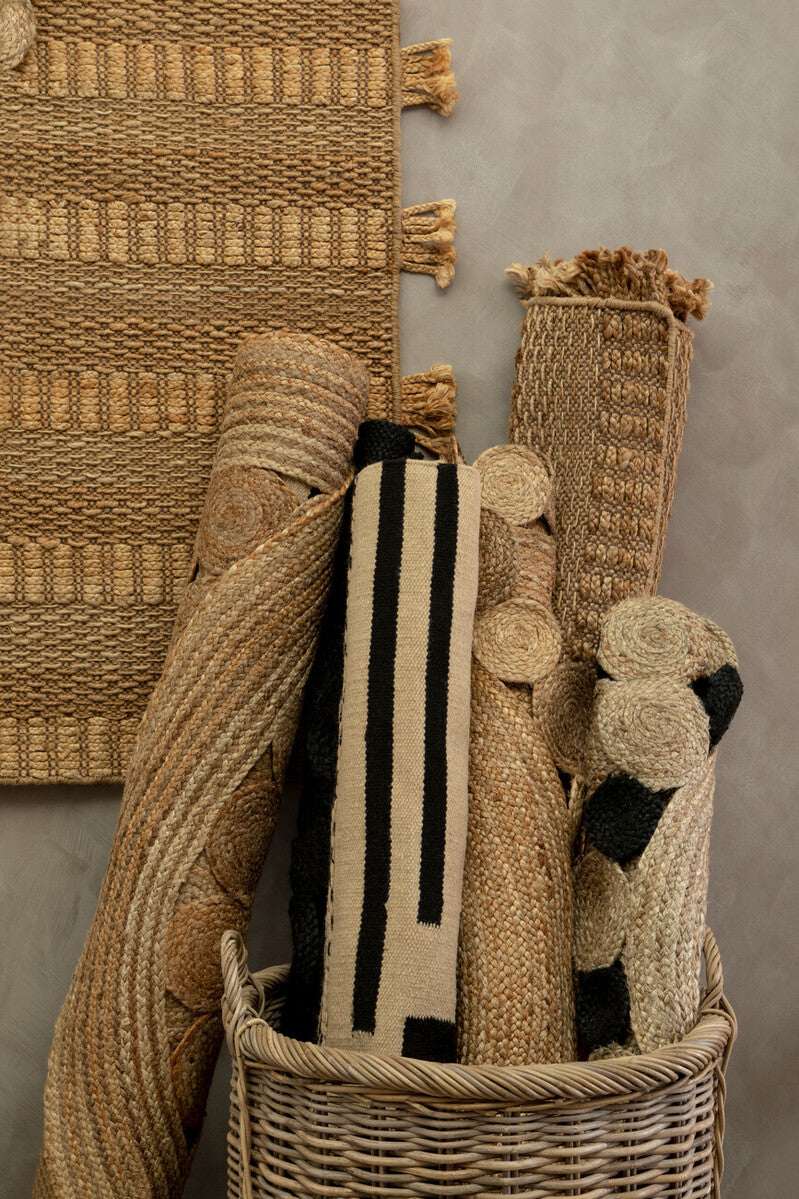 Variety of Orsina rugs including the Trenza Rug in neutral tones for stylish home decor