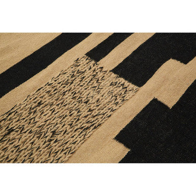 Orsina Trenza Rug with a textured black and natural pattern for stylish home decor