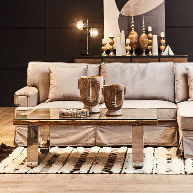 Orsina Tribal Rug featuring a geometric design under a modern coffee table in a stylish living room