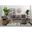 Orsina Tribal Rug featured in a stylish living room with modern furniture and greenery.