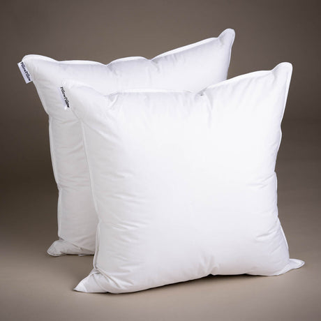 Two soft white PillowPillow brand pillows ideal for comfortable sleeping or decorative use