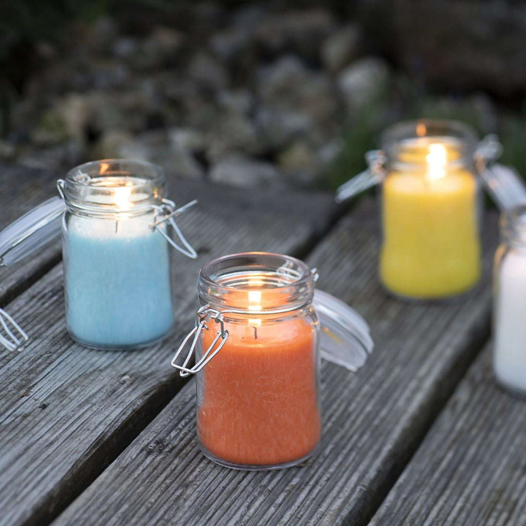 Colourful wax candles in glass jars, featuring pure olive wax for a natural ambiance