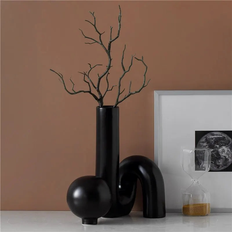 Modern black vase from Nisu Home with artistic design and branches for contemporary decor