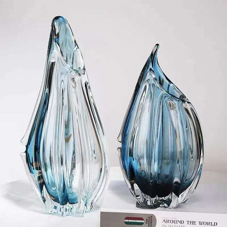 Elegant Nisu Home glass vases with a swirling design in blue and clear for stylish decor
