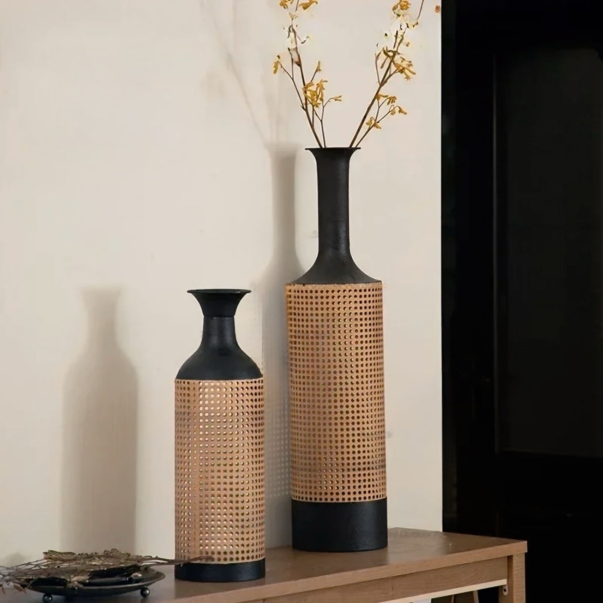 Elegant Nisu Home decorative vases in black and natural tones, perfect for floral arrangements