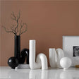 Elegant Nisu Home ceramic vases in black and white, perfect for modern home decor