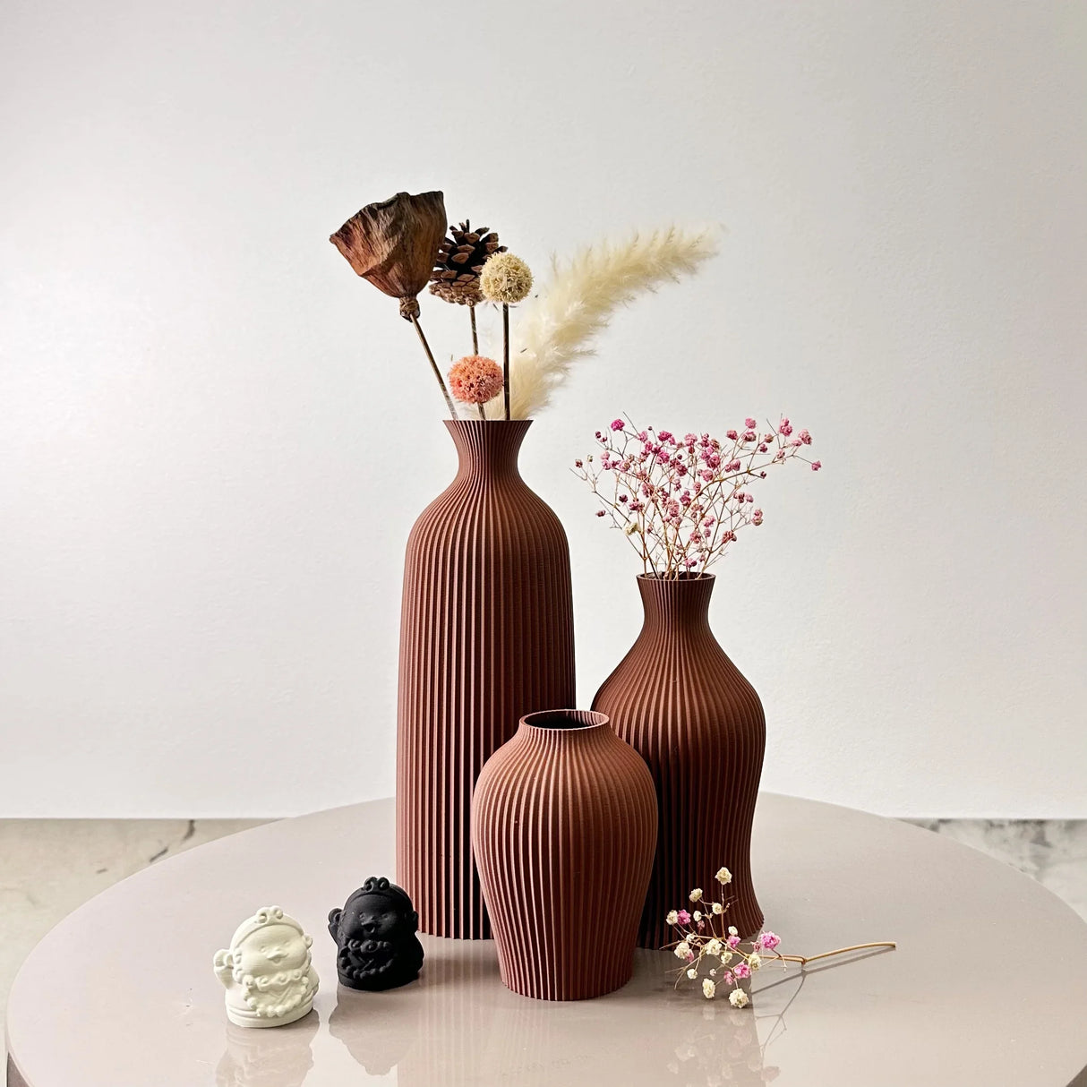Set of three ceramic vases in terracotta with ribbed design for elegant floral displays