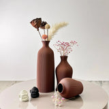 Elegant Nisu Home vases in terracotta with decorative dried flowers for stylish home decor