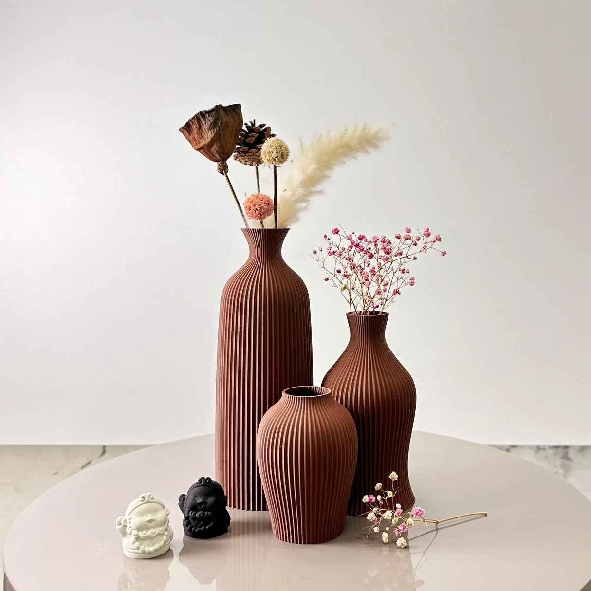 Stylish Nisu Home vase set in brown with textured design, perfect for floral arrangements
