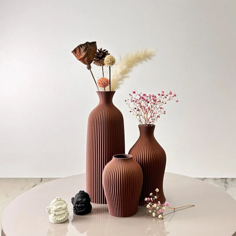 Stylish Nisu Home vase set in brown with textured design, perfect for floral arrangements