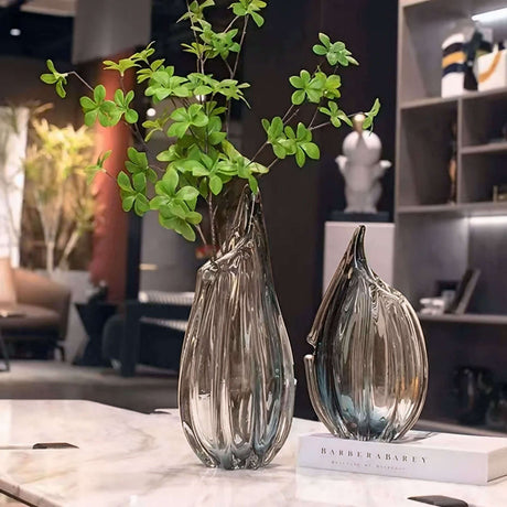 Elegant Nisu Home glass vase set with decorative green foliage for stylish home decor