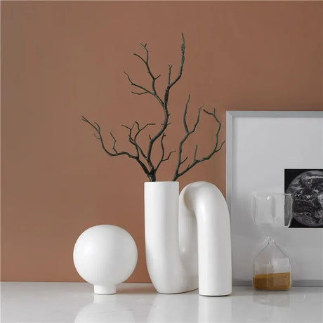 Contemporary Nisu Home vase in white ceramic with a minimalist design and dried branches