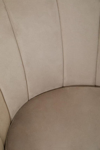 Close-up of a comfortable Orsina Velvet Chair featuring soft fabric and a plush seat design