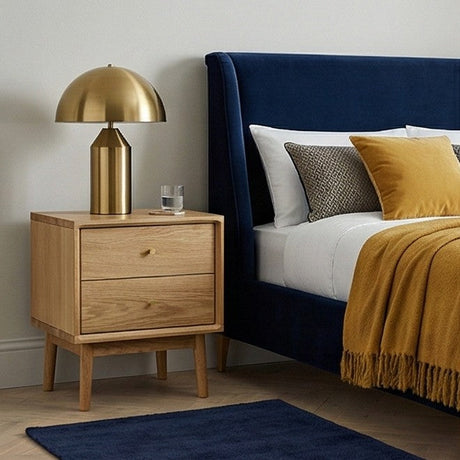 Fishe and Lilly Bedside Table in natural wood with two drawers and a stylish gold lamp