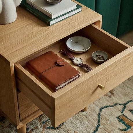Stylish Fishe and Lilly Bedside Table with a drawer containing a notebook and watch
