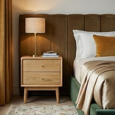 Stylish Fishe and Lilly Bedside Table with two drawers and a lamp in a modern bedroom setting