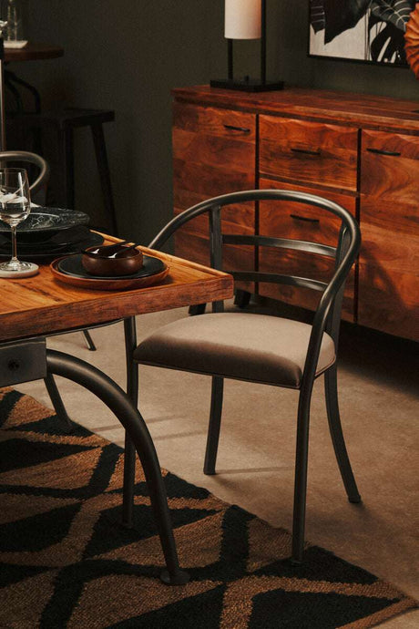 Stylish Orsina Hemp Rug under a wooden dining table with a modern chair, enhancing interior decor