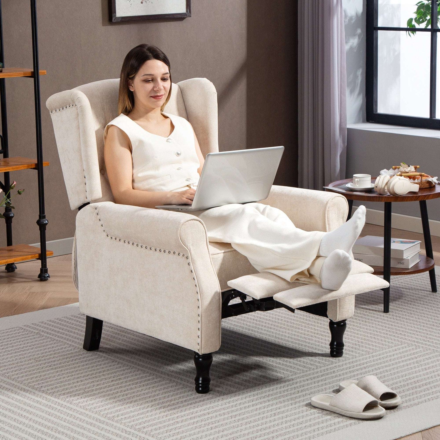 Comfortable Vintage Armchair with a reclining footrest, perfect for relaxation and working on a laptop