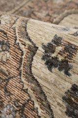 Detailed close-up of a Vintage Rug with intricate floral patterns and warm earthy tones