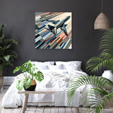 Modern Wall Art Canvas featuring a stylised airplane flying over abstract stripes in a contemporary living space