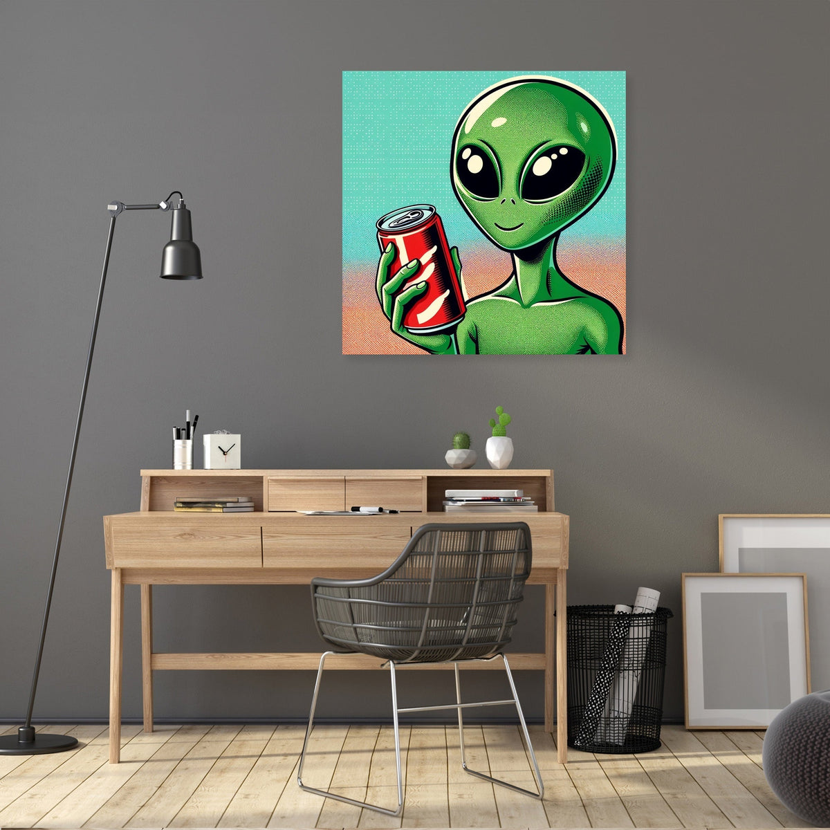 Colourful Wall Art Canvas featuring a green alien holding a soda can in a stylish workspace