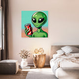 Colourful Wall Art Canvas featuring a green alien holding a soda can in a modern bedroom setting