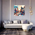 Colourful urban Wall Art Canvas depicting a busy city street scene above a modern sofa