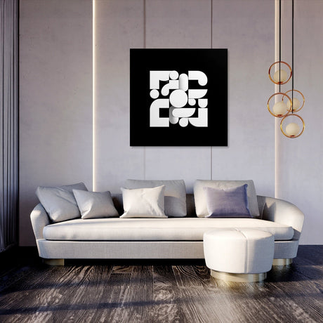 Modern abstract wall art canvas featuring geometric shapes in black and white above a stylish sofa