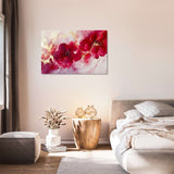 Vibrant pink floral wall art canvas decorating a modern living room with natural light