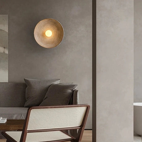 Stylish Light My House Wall Lamp creating warm ambient lighting in a modern living room