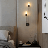Elegant black metal wall light with two warm bulbs, perfect for bedroom ambience