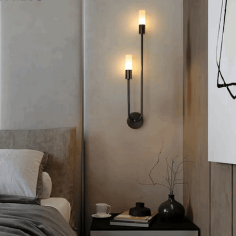 Elegant black metal wall light with two warm bulbs, perfect for bedroom ambience