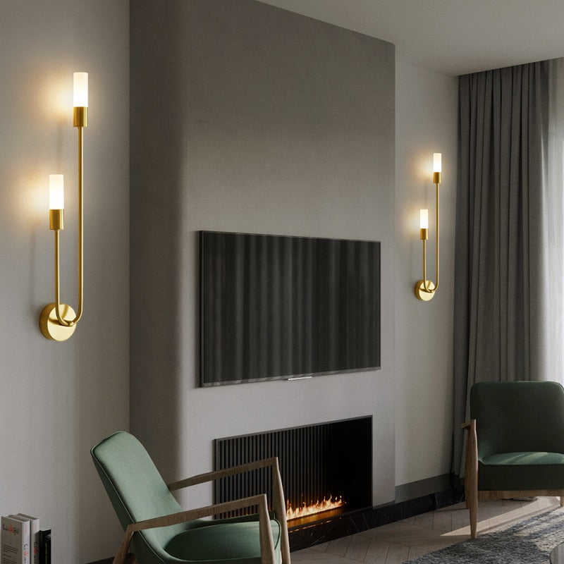 Elegant Light My House Wall Light in gold finish illuminating a modern living room with stylish decor