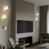 Elegant Light My House Wall Light in gold finish illuminating a modern living room with stylish decor