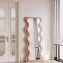 Nisu Home Wall Mirror with a unique wavy frame, ideal for modern home decor
