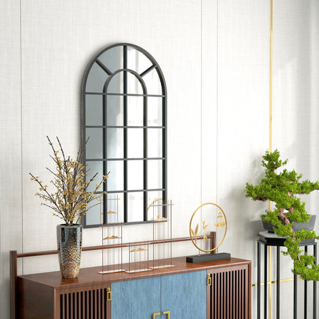 Elegant wall mirror with an arched design, perfect for enhancing bathroom decor and natural light