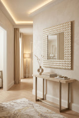 Orsina Wall Mirror with Textured Frame Above Console Table in Elegant Hallway