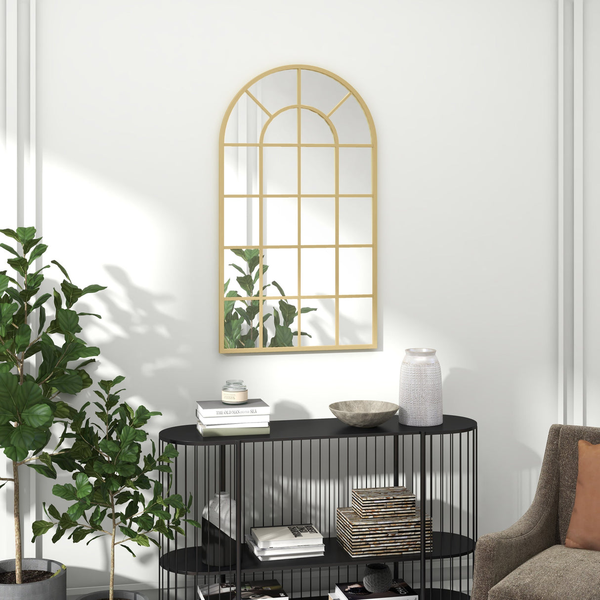 Elegant wall mirror with arched design and gold frame, enhancing any bathroom decor