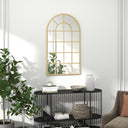 Elegant wall mirror with arched design and gold frame, enhancing any bathroom decor