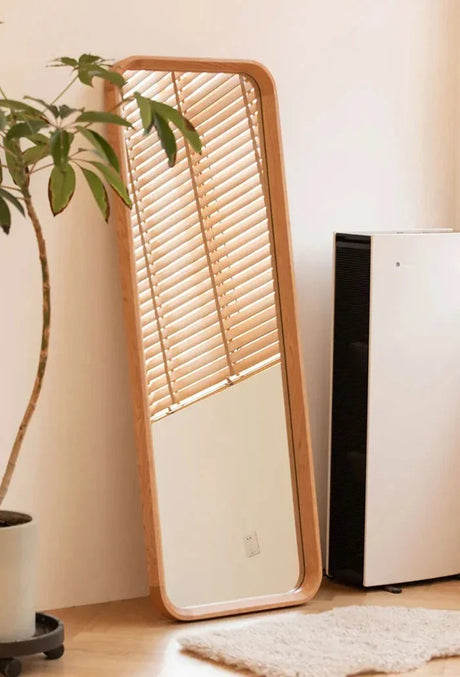 Nisu Home Wall Mirror with a Natural Wood Frame Leaning Against the Wall