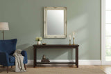 Orsina Wall Mirror with Ornate Frame Above a Dark Wood Console Table in a Stylish Living Room