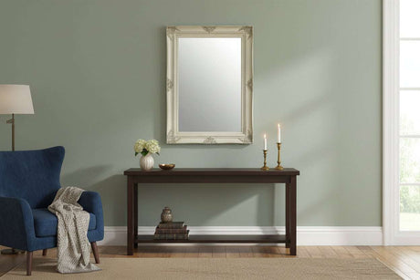 Orsina Wall Mirror with Ornate Frame Above a Dark Wood Console Table in a Stylish Living Room