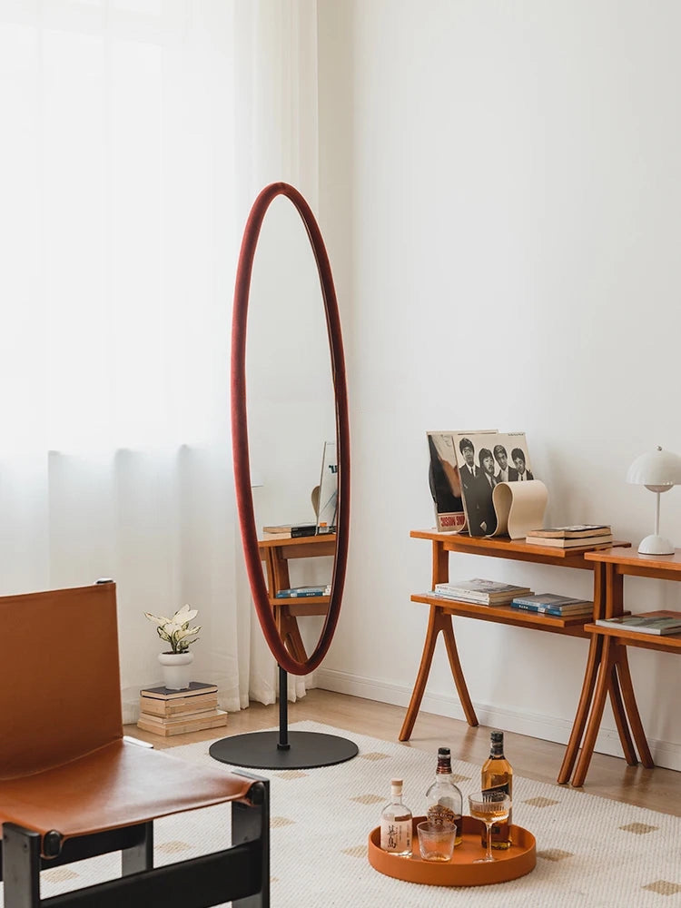 Nisu Home Modern Wall Mirror with a Stylish Oval Frame in a Contemporary Living Room Setting