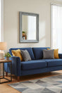 Orsina Wall Mirror in Vintage Grey Frame Above Blue Sofa with Cushions for Elegant Home Decor