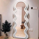 Stylish Nisu Home Wall Mirror with unique wavy design, perfect for modern interior decor
