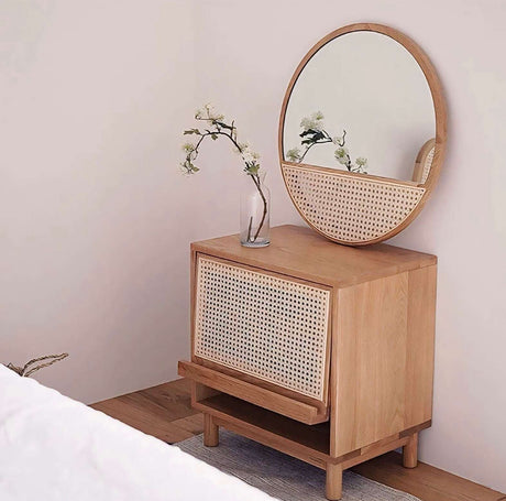 Round Wall Mirror above a natural wood cabinet with a minimalist design by Nisu Home