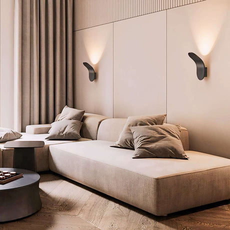 Modern Nisu Home Wall Sconce illuminating a stylish living room with soft lighting and minimalist decor