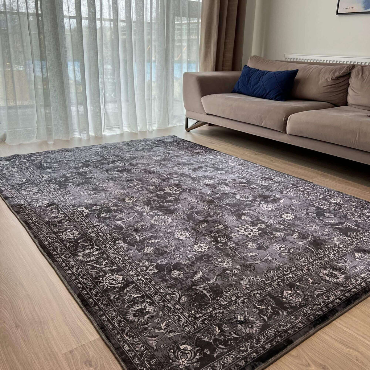Elegant grey patterned washable rug enhancing the living room decor with a soft texture