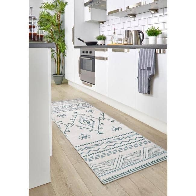 Stylish washable rug in a kitchen setting with geometric patterns and a light colour scheme